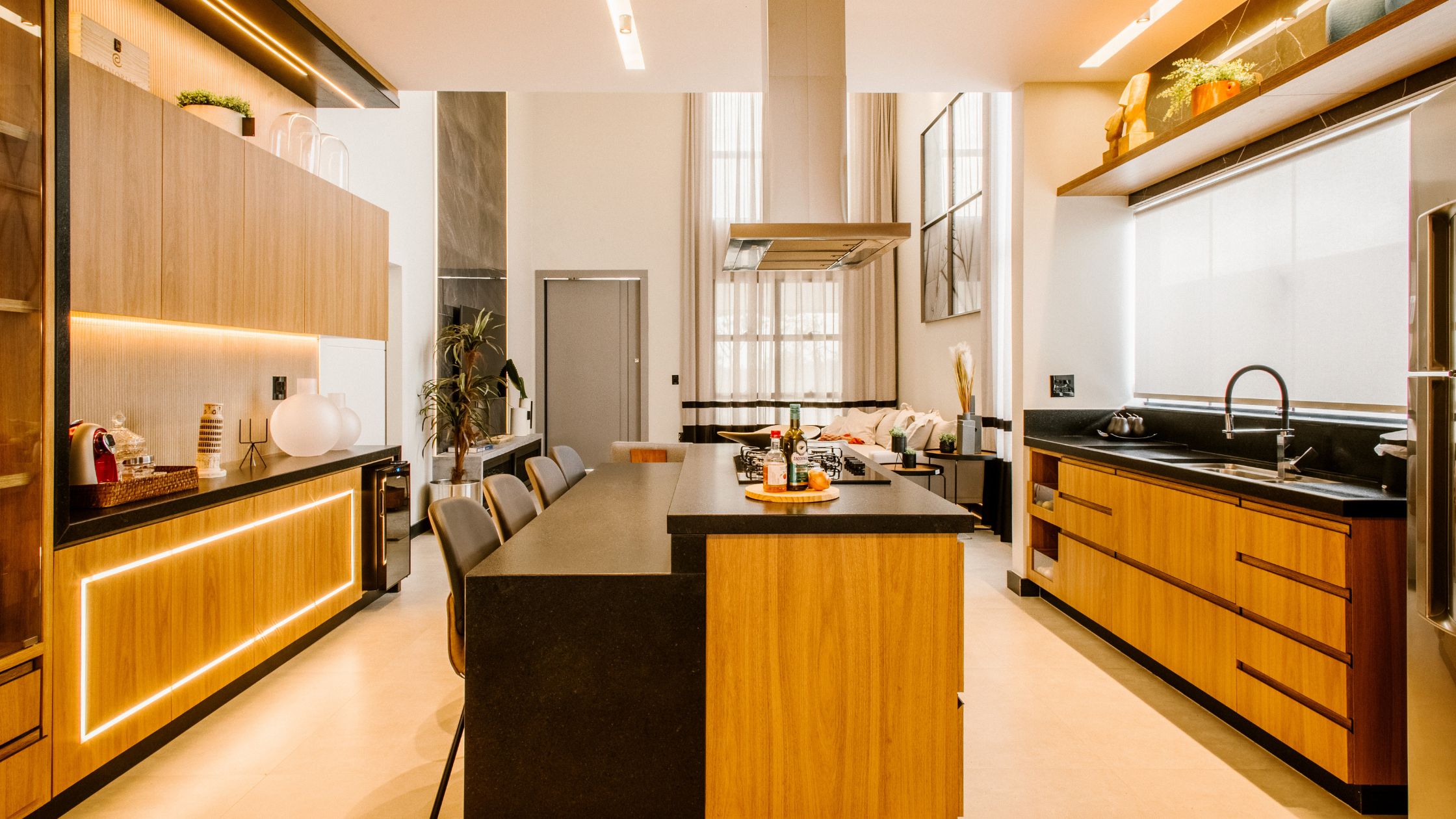 Modern Ontario kitchen showcasing 2025 kitchen design trends with statement island, wood cabinetry, bold lighting, and sleek countertops.