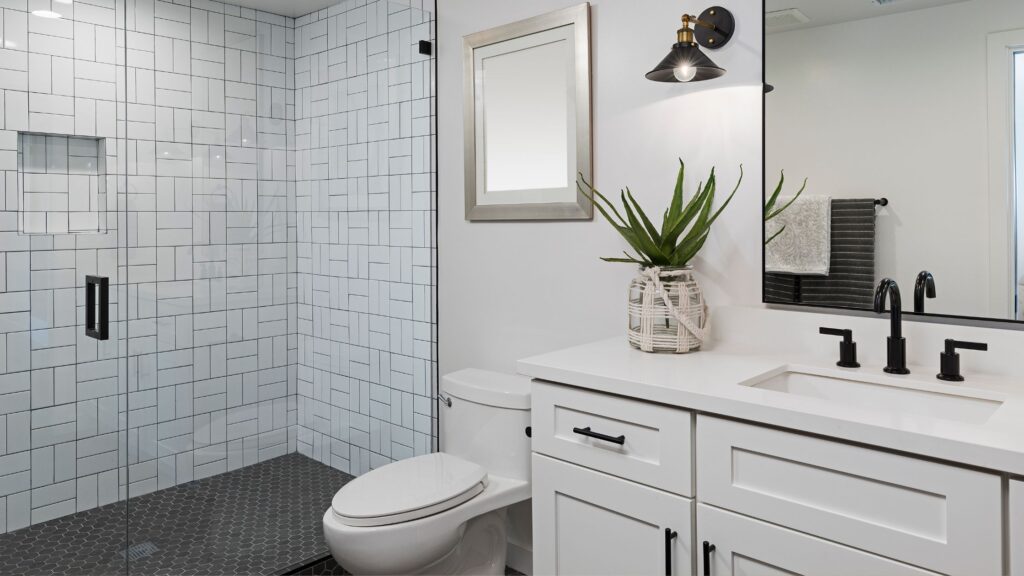 Modern bathroom remodel with walk-in shower and white vanity – example of how to renovate a bathroom in the GTA for style and functionality